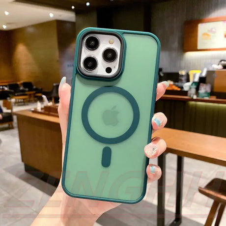 a person holding a green phone case