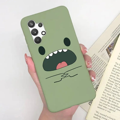 a person holding a book and a phone case