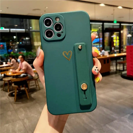 a person holding a green phone case