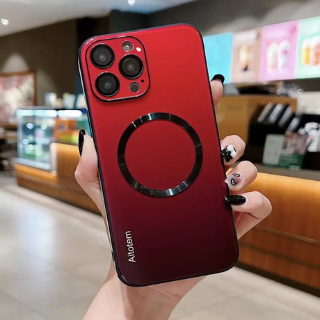 a person holding a red iphone case