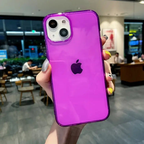 a person holding a purple iphone case