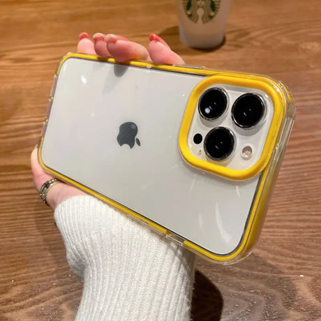 a person holding a yellow iphone case