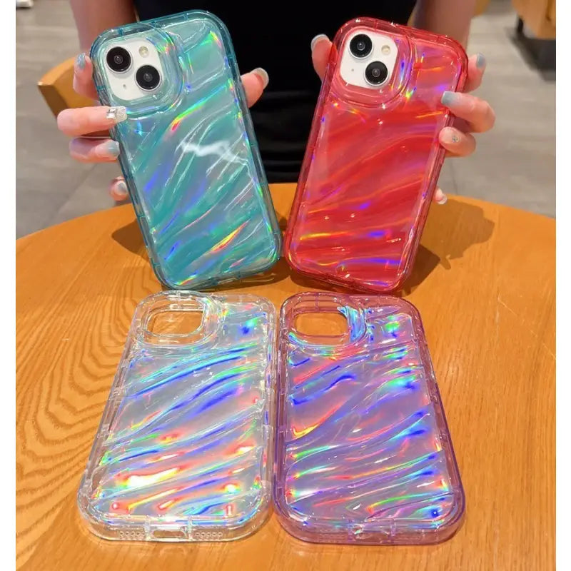 a close up of two people holding up two different colored cases