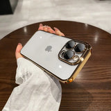 a person holding an iphone with a gold case