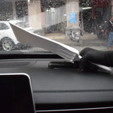a knife is stuck into the windshield of a car
