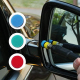 a person is holding a car mirror with a sponge