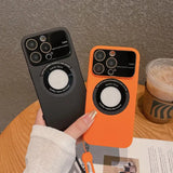 a hand holding an orange and black iphone case