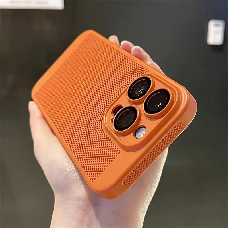 a person holding an orange iphone case