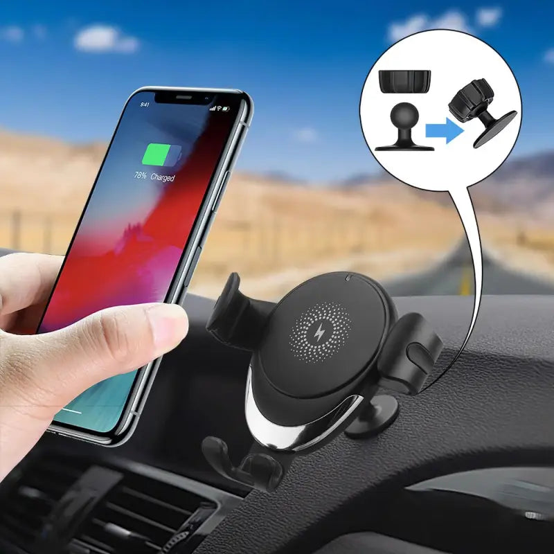 a hand holding a phone in the dashboard of a car