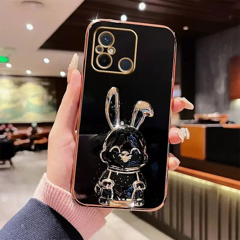 a person holding a phone with a black and white rabbit on it
