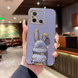 a person holding a phone case with a blue rabbit