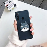 a person holding a phone case with a cat on it