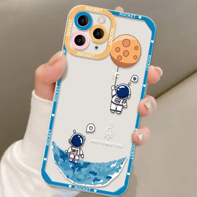 a person holding a phone case with a cartoon character