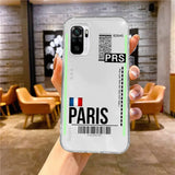 a person holding a phone case with the paris logo on it
