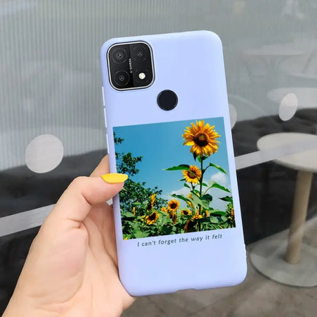 a person holding a phone case with a sunflower on it