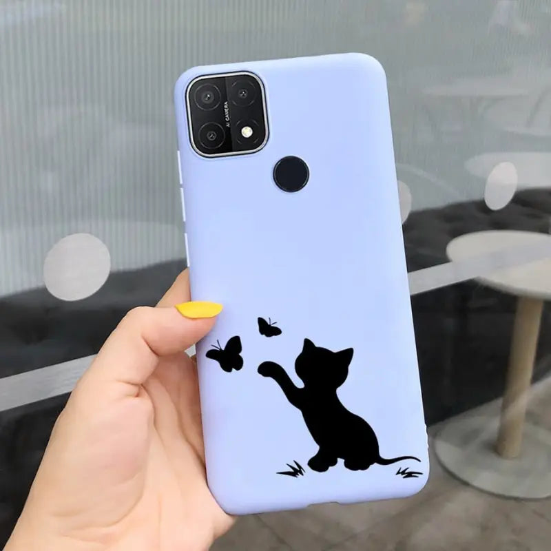 a person holding a phone case with a cat silhouette