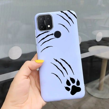 a person holding a phone case with a dog face on it