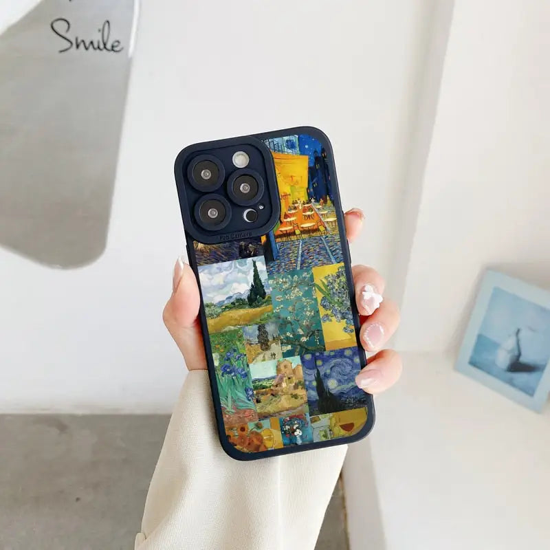 someone holding a phone with a painting on it in their hand