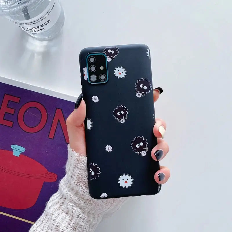 a person holding a phone case with a flower pattern