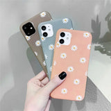 three iphone cases with daisies on them are shown in different colors
