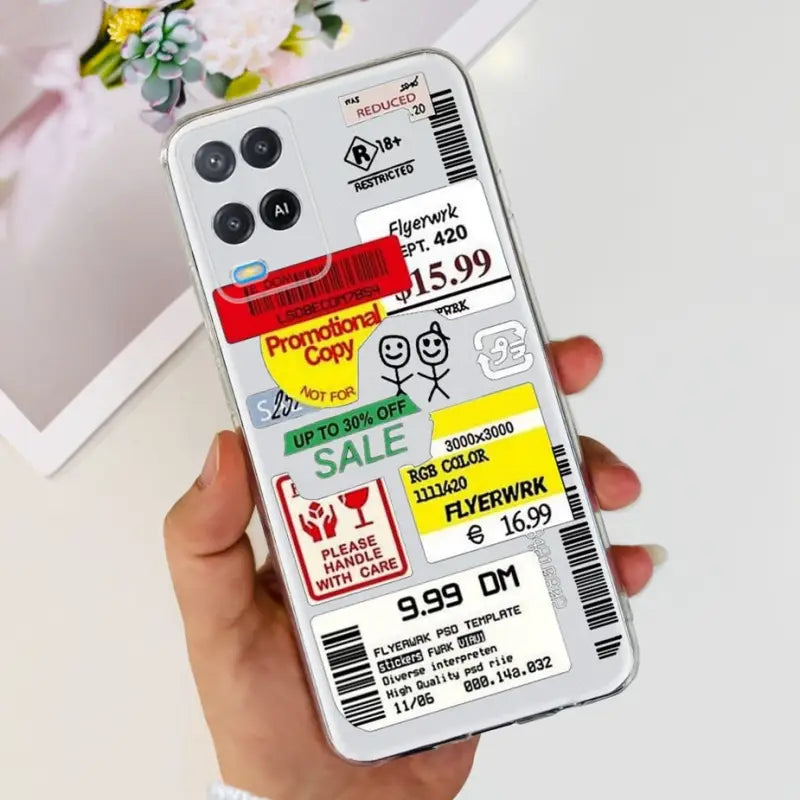 a person holding a phone case with stickers on it