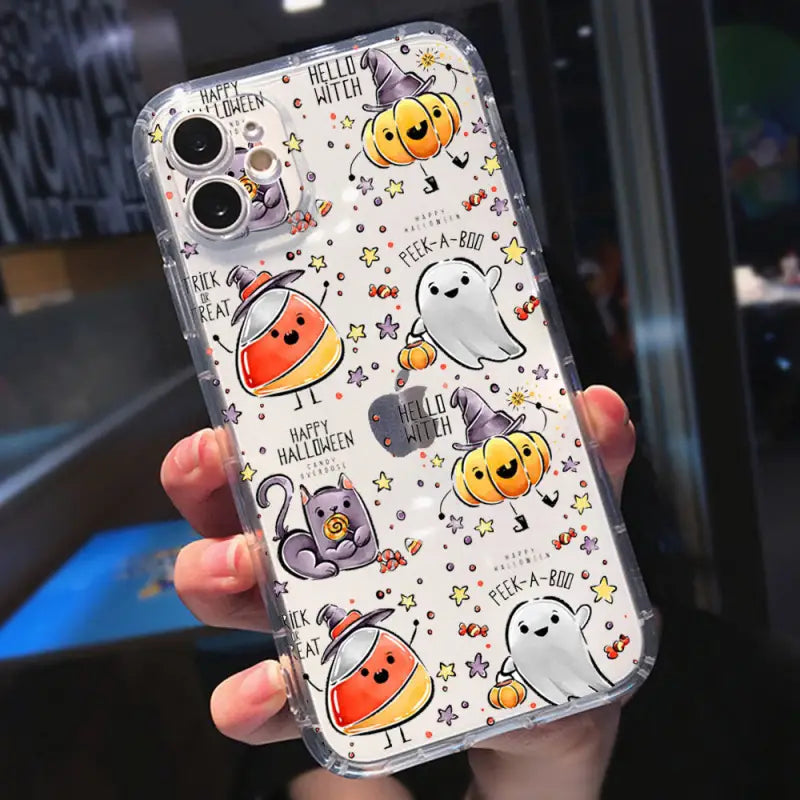 a person holding a phone case with halloween themed design
