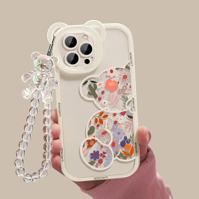 a hand holding a phone case with a chain