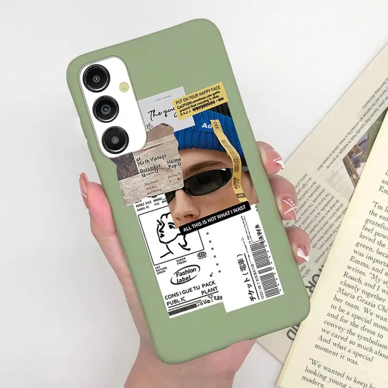 a person holding a book and a cell case