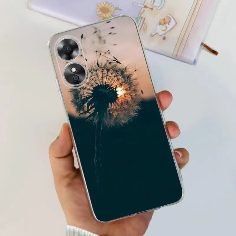 a person holding a phone case with a dann flower on it