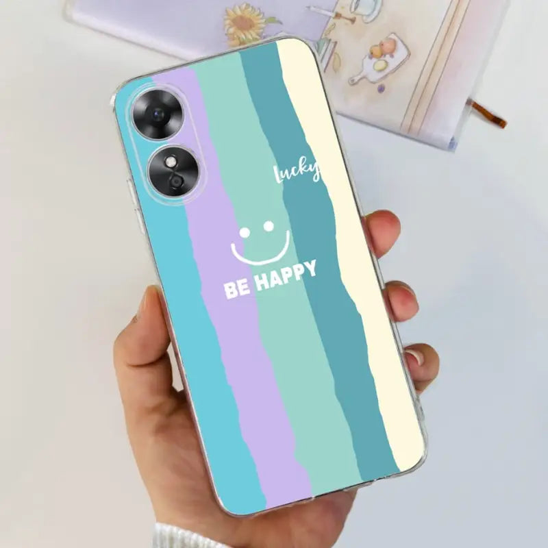 a person holding a phone case with the words be happy