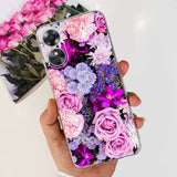 a person holding a phone case with flowers on it