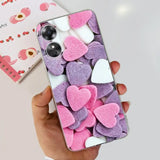 a person holding a phone with pink and white hearts