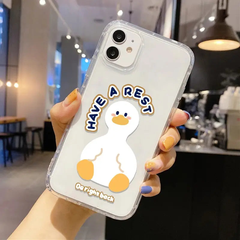a person holding a phone case with a duck
