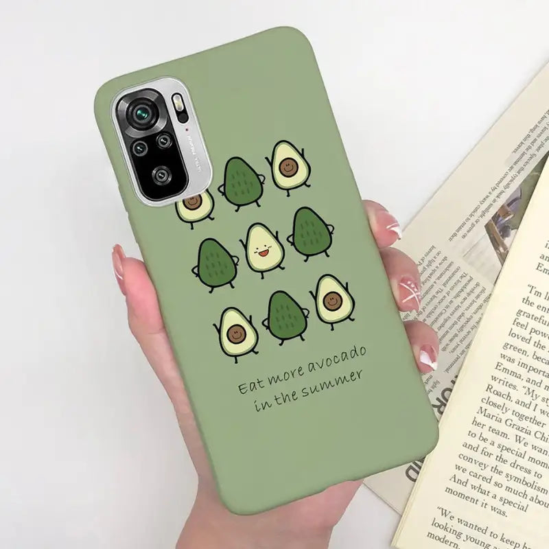 a person holding a phone case with a green background