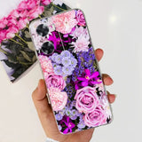 a person holding a phone case with flowers on it