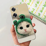 a cat wearing a green hat on a phone