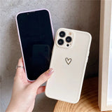 a person holding a phone case with a heart on it