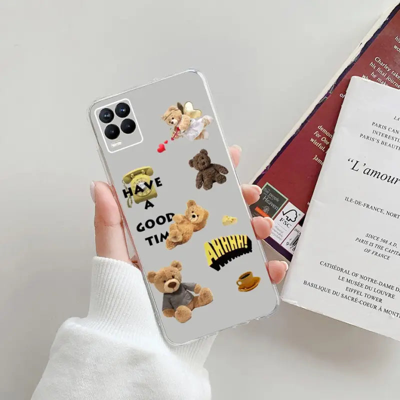 a person holding a phone case with a picture of a teddy bear