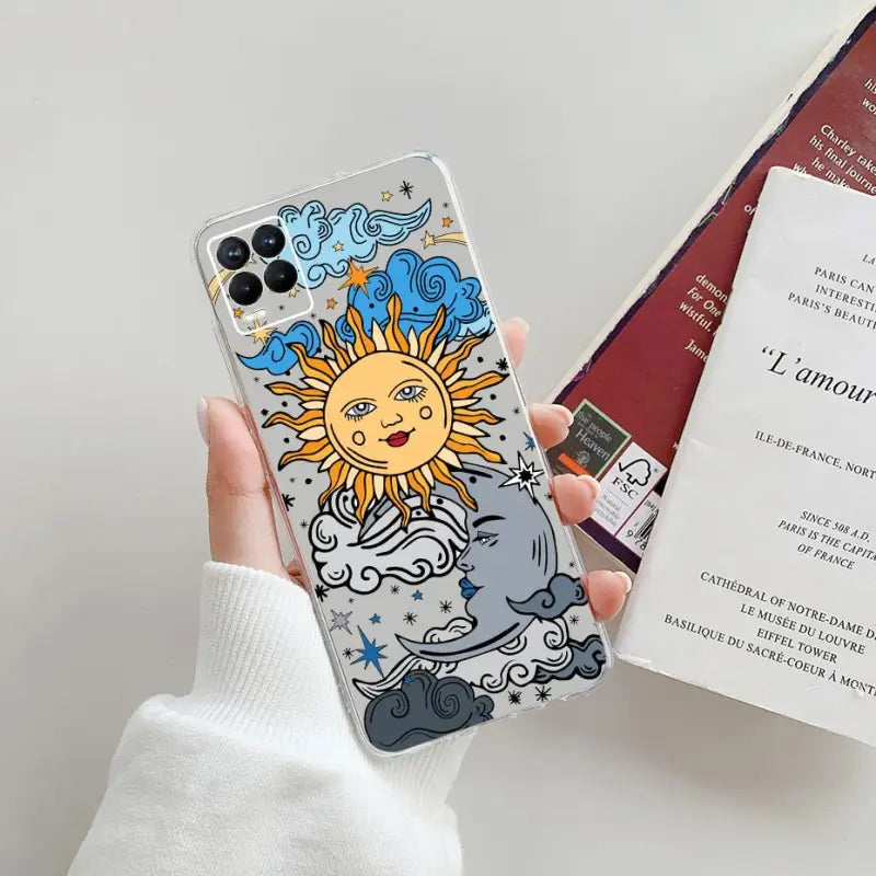a person holding a phone case with a sun and clouds
