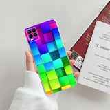 a person holding a phone case with a colorful cube pattern