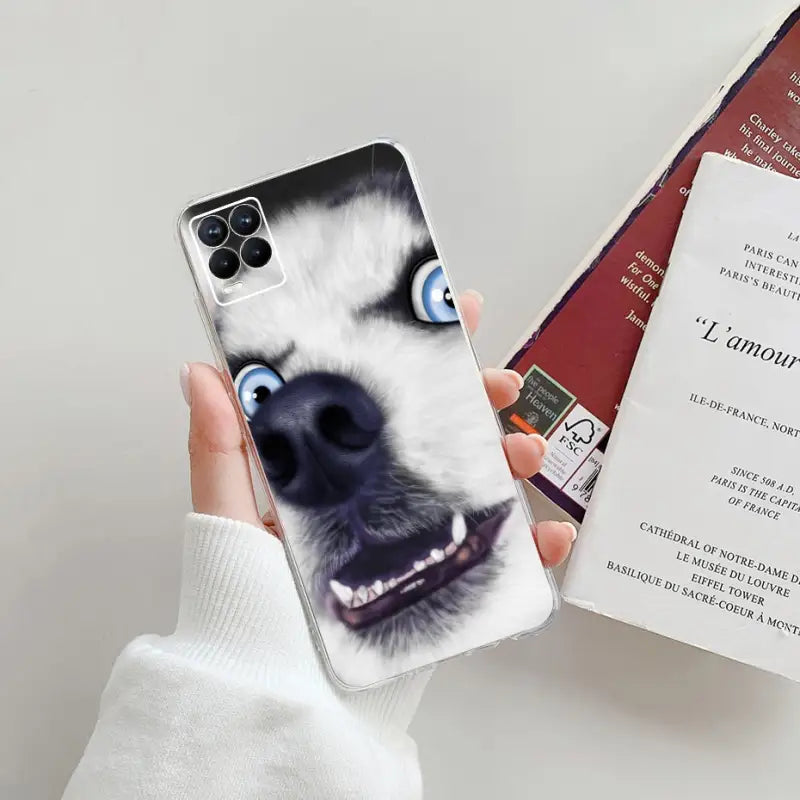 a person holding a phone case with a dog face