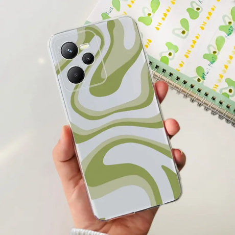 a hand holding a green and white phone case