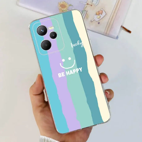 a person holding a phone case with a happy face on it