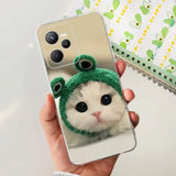 a cat wearing a green hat on a phone