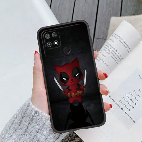 a close up of a person holding a phone case with a deadpool on it