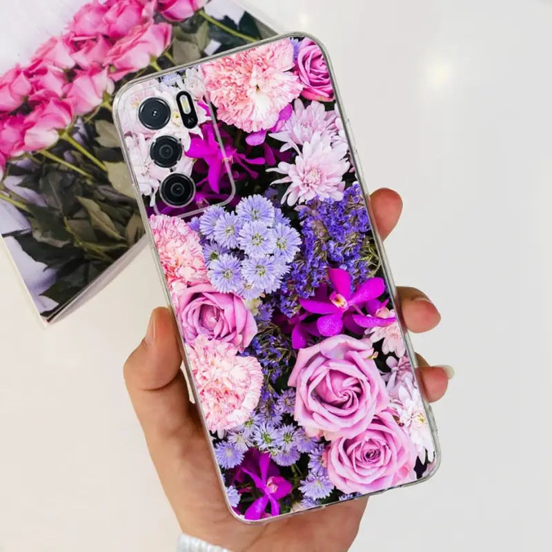 a person holding a phone case with flowers