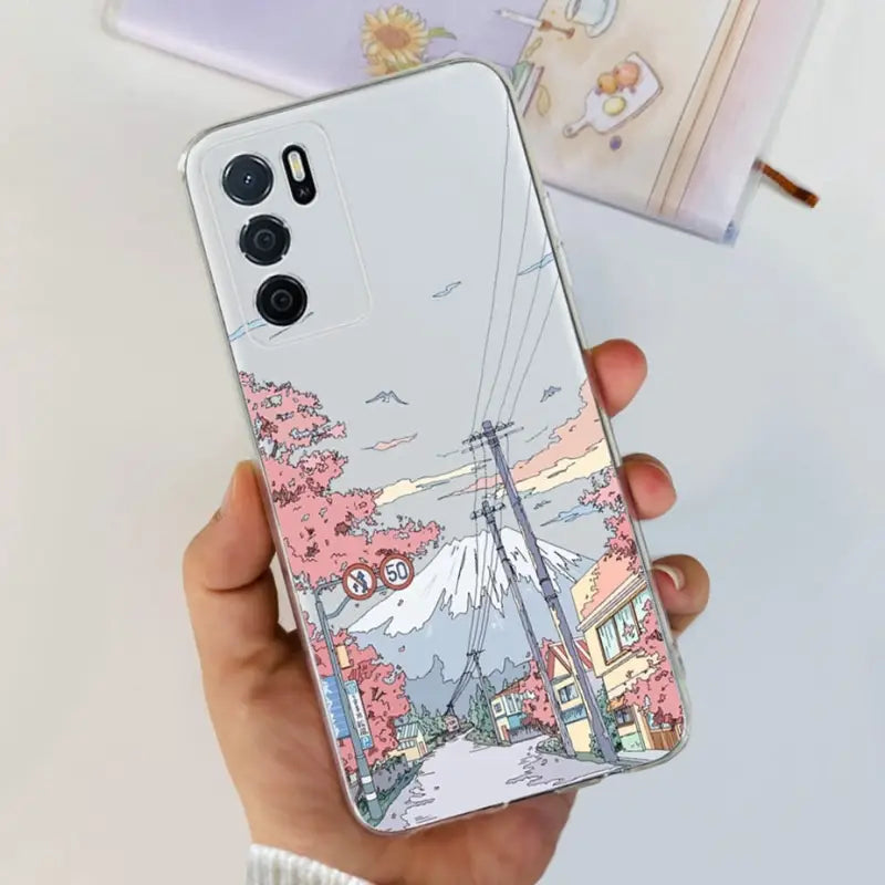 a person holding a phone case with a drawing of a city