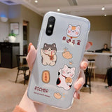 a person holding a phone case with cartoon characters on it