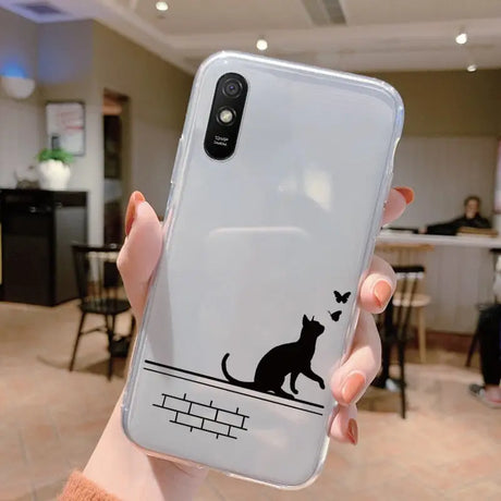 a person holding a phone case with a cat on it