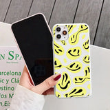 a person holding a phone case with a yellow and black pattern